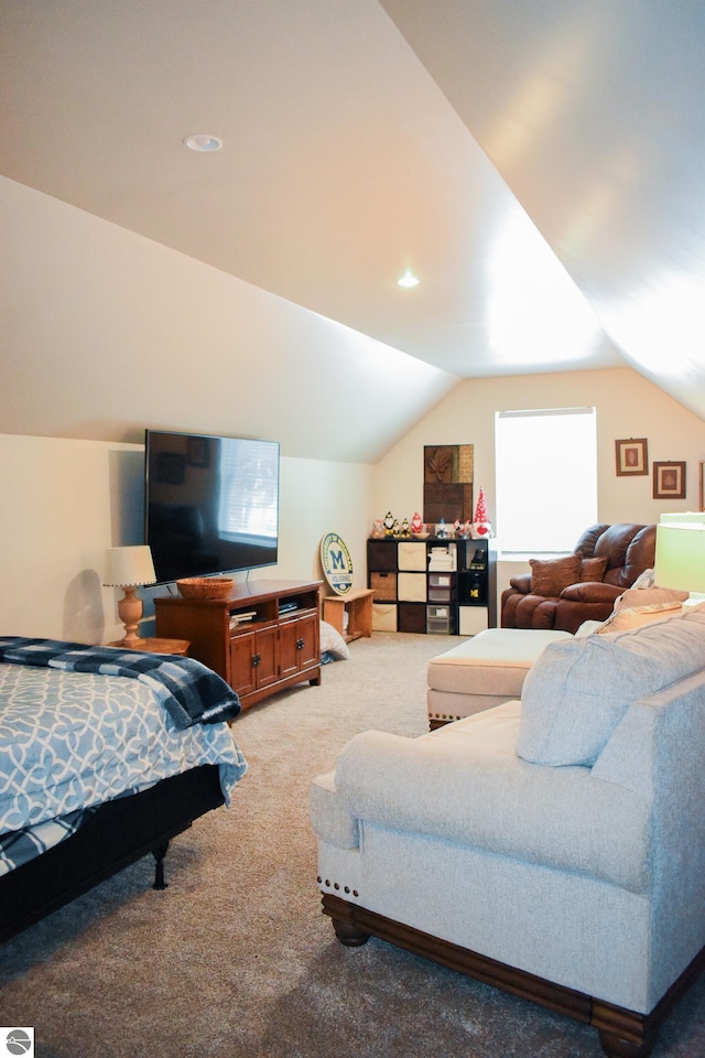 bedroom featuring lofted ceiling and carpet flooring