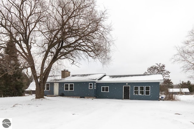 view of snow covered house