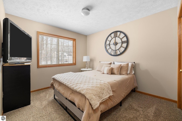 bedroom featuring a textured ceiling and light carpet