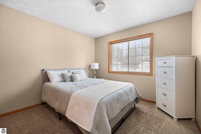 bedroom with carpet floors and a textured ceiling