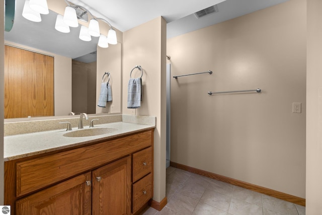 bathroom with vanity and tile patterned flooring