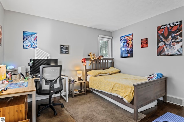 bedroom featuring dark hardwood / wood-style floors