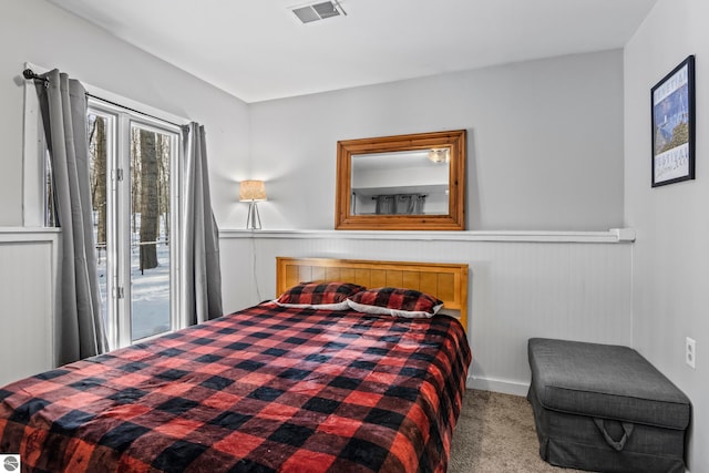 carpeted bedroom featuring access to outside