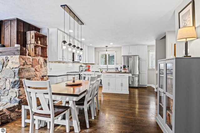 dining area with dark hardwood / wood-style floors