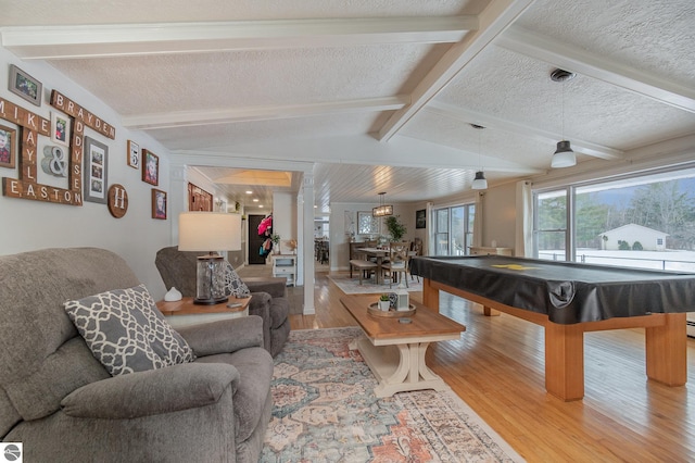 playroom with a textured ceiling, billiards, wood-type flooring, and lofted ceiling with beams