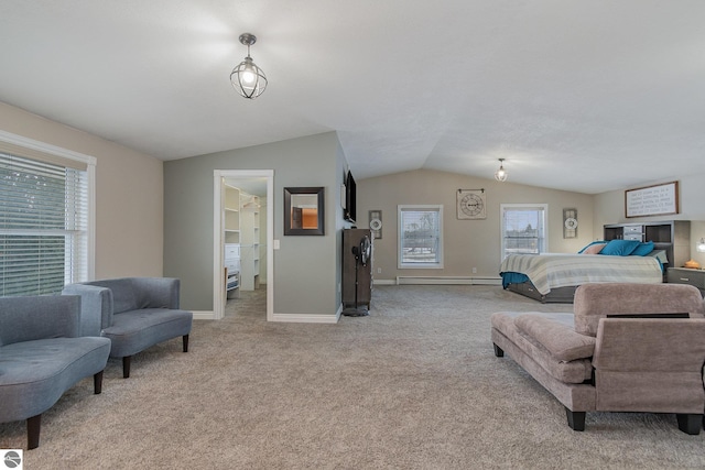 carpeted bedroom with vaulted ceiling and a baseboard radiator