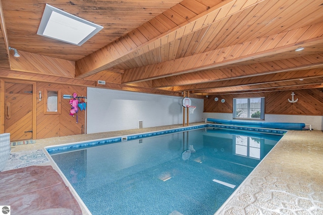 view of swimming pool with a skylight