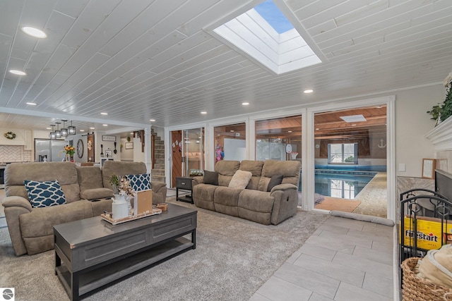 tiled living room with a skylight, wood ceiling, and ornamental molding