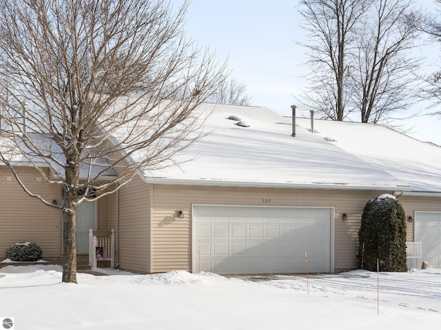 view of snow covered garage