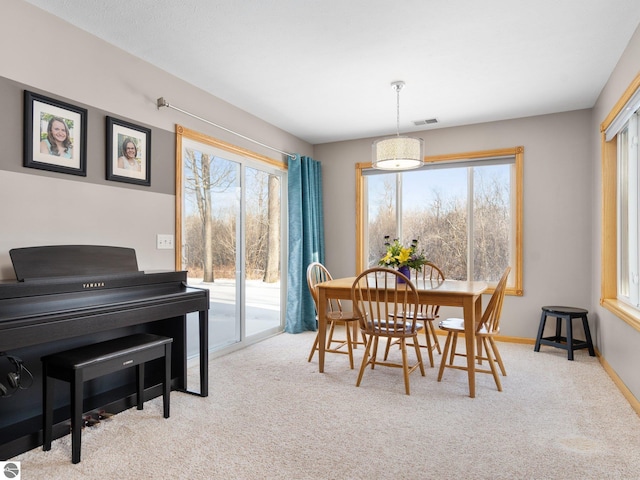 view of carpeted dining space