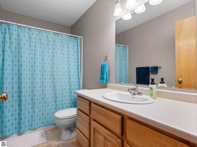 bathroom featuring vanity, toilet, and tile patterned flooring