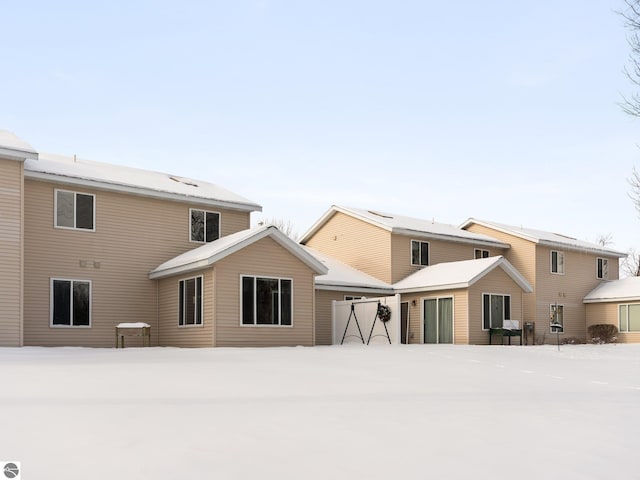 view of snow covered house