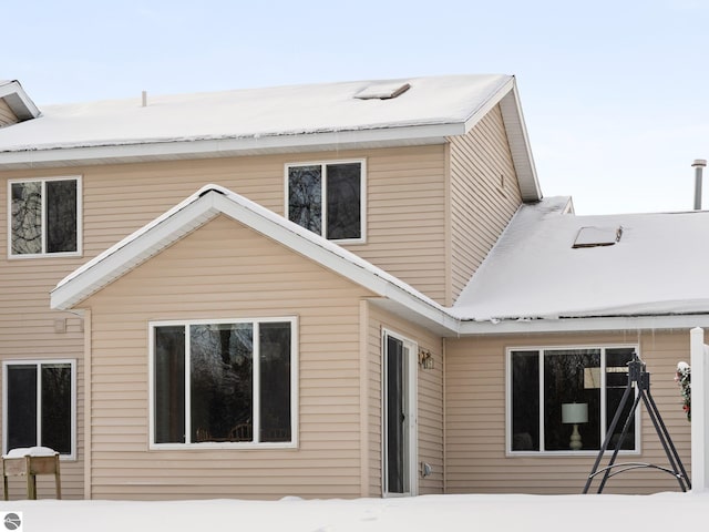 view of snow covered house