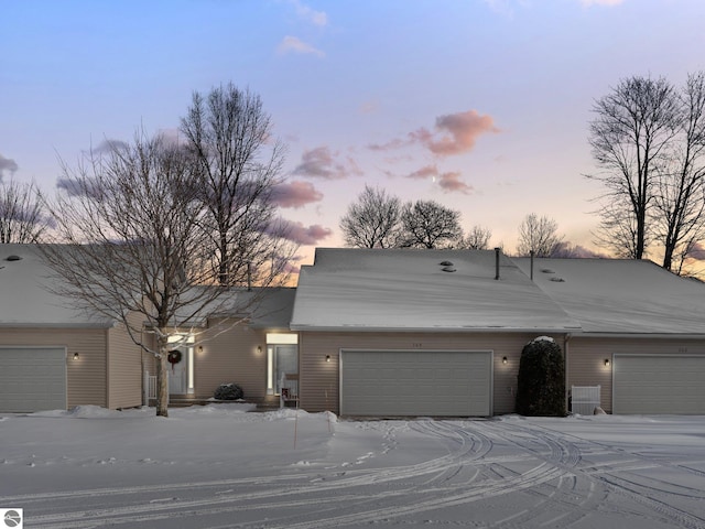 ranch-style house featuring a garage