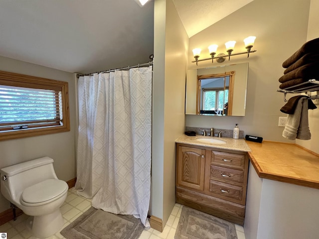 bathroom with tile patterned floors, vanity, and toilet