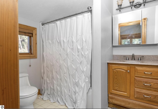 full bathroom featuring toilet, vanity, and shower / tub combo