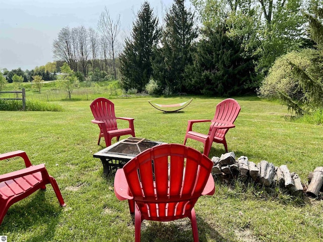 view of yard with a fire pit