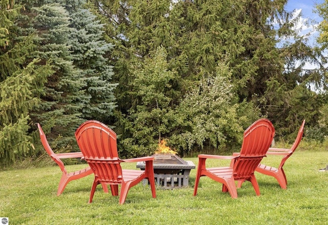 view of yard with a fire pit