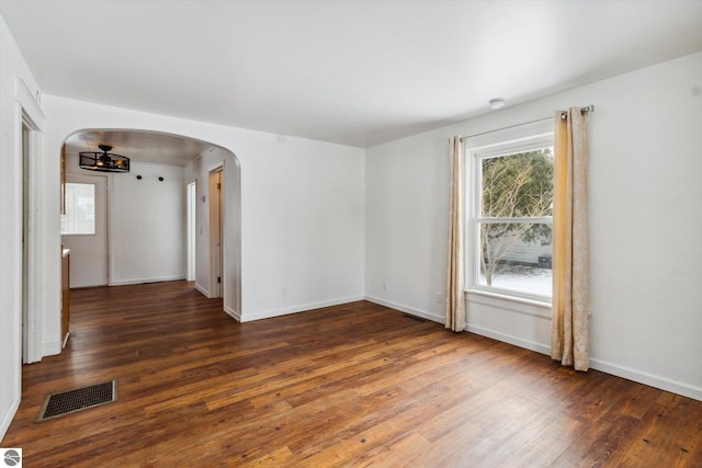 empty room featuring dark wood-type flooring