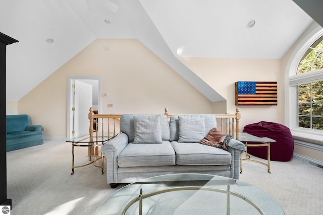 living room with light carpet and vaulted ceiling