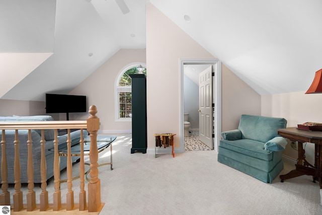 office space featuring vaulted ceiling and light carpet