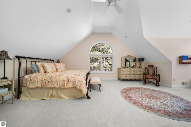 carpeted bedroom featuring vaulted ceiling and ceiling fan