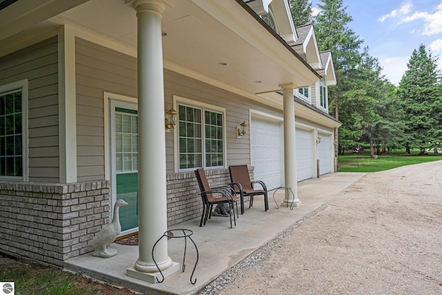 view of patio featuring a garage