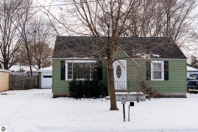 view of front of home featuring an outdoor structure and a garage