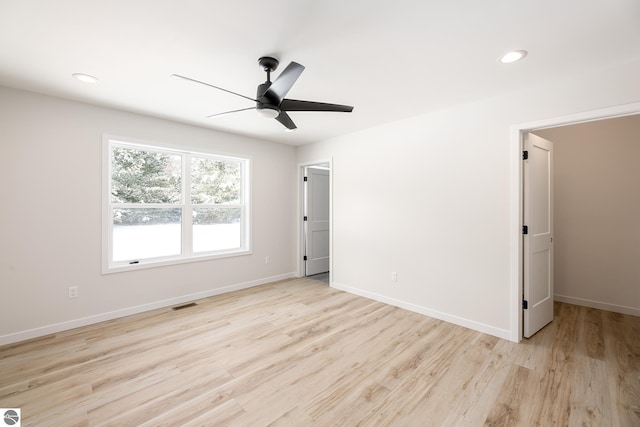 unfurnished bedroom featuring ceiling fan and light hardwood / wood-style flooring