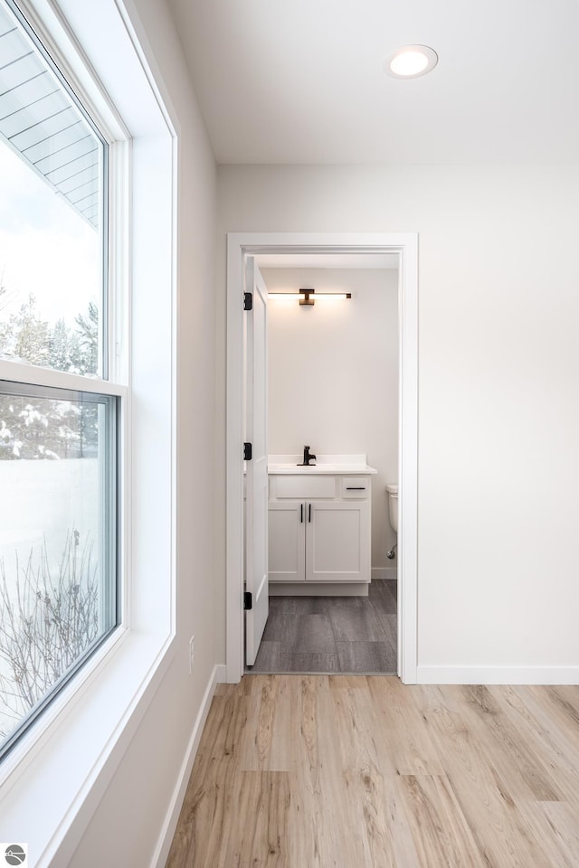 corridor featuring light hardwood / wood-style flooring