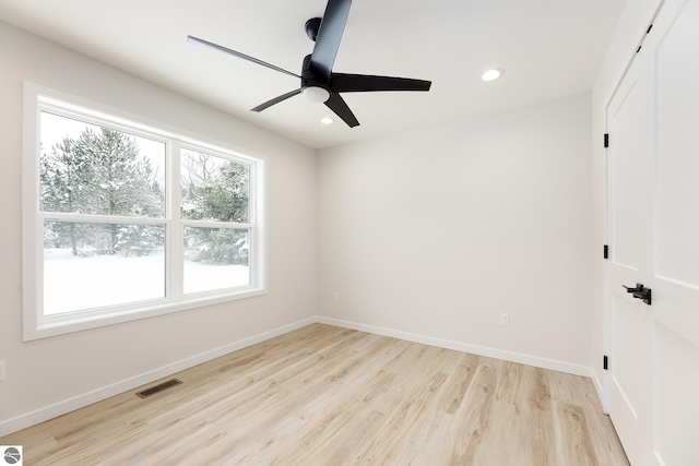 unfurnished room with light hardwood / wood-style flooring and ceiling fan