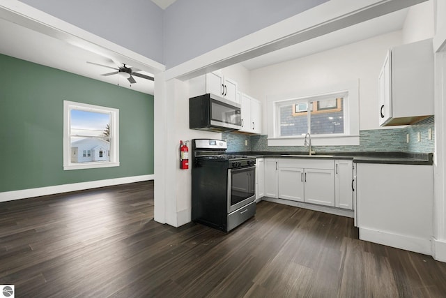 kitchen with sink, white cabinetry, appliances with stainless steel finishes, and tasteful backsplash