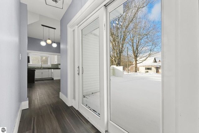 hall with dark wood-type flooring