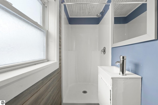 bathroom with vanity and walk in shower