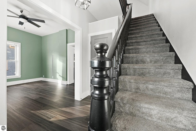 stairway with hardwood / wood-style flooring and ceiling fan