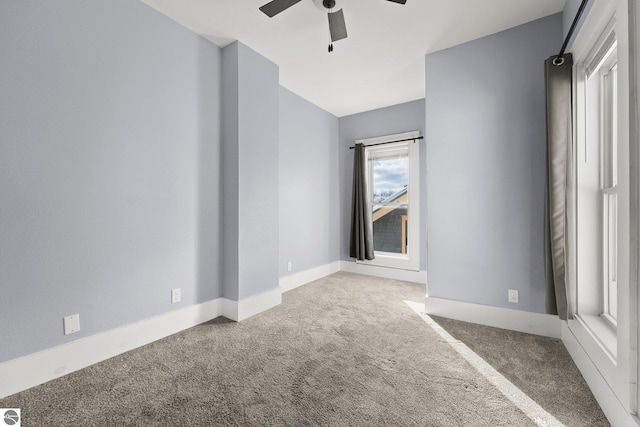 unfurnished room with carpet floors and ceiling fan