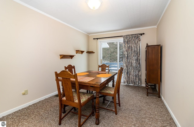 carpeted dining space with ornamental molding