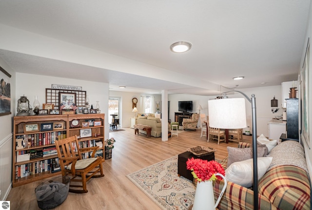 living room with light hardwood / wood-style flooring