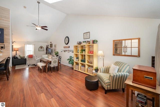 interior space with ceiling fan, wood-type flooring, and lofted ceiling