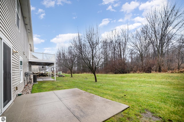 view of yard featuring a patio area and central AC unit