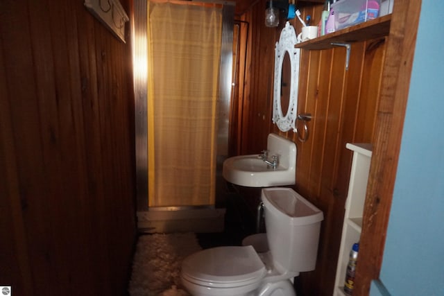 bathroom featuring a shower and toilet