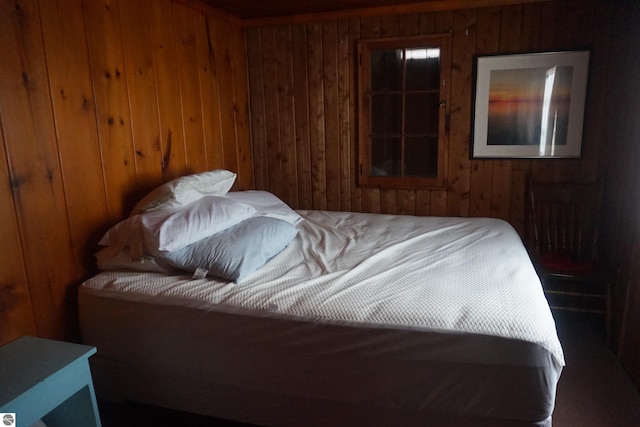 bedroom with wooden walls