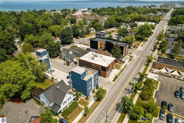 birds eye view of property with a water view