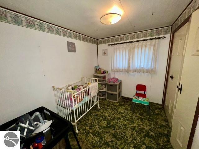 bedroom with a nursery area