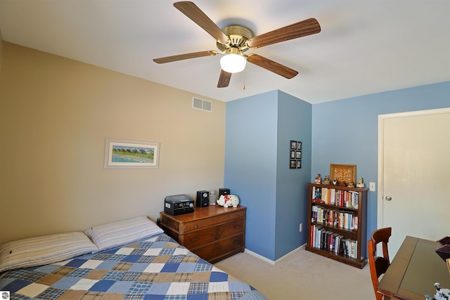 bedroom featuring ceiling fan and light carpet