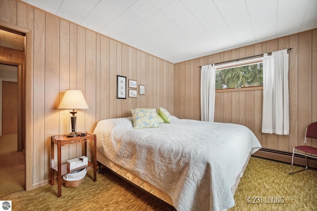 carpeted bedroom with a baseboard heating unit