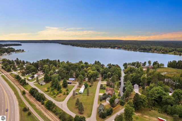 aerial view at dusk with a water view