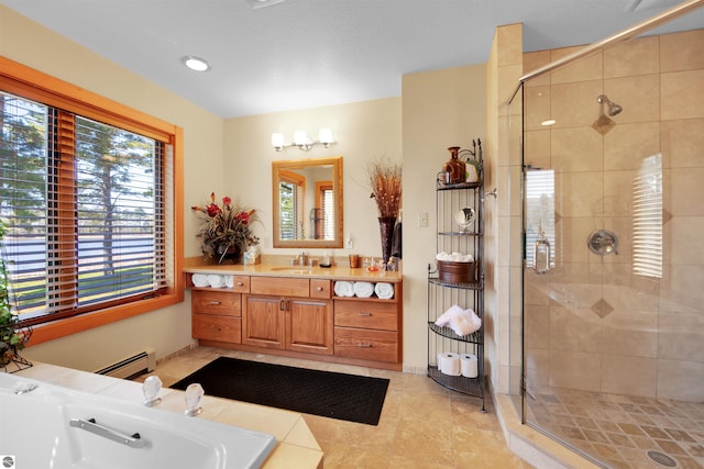 bathroom with a baseboard radiator, a shower with shower door, tile patterned floors, and vanity