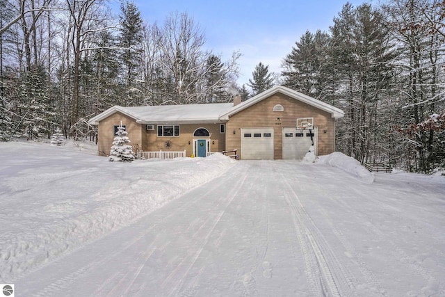 ranch-style house featuring a garage