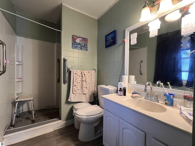 bathroom with walk in shower, vanity, toilet, and hardwood / wood-style floors